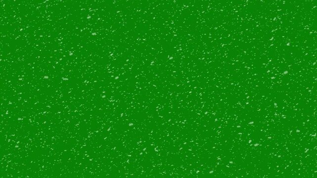 White snow particles floating in the air on green background. snowflakes christmas, rendered animation of snowing, isolated transparent snowfall pattern with overlay effect, 4k video