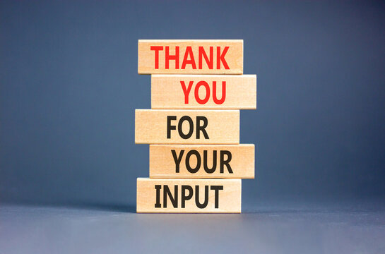 Thank you for your input symbol. Concept words Thank you for your input on beautiful wooden blocks. Beautiful grey background. Business and thank you for your input concept. Copy space.