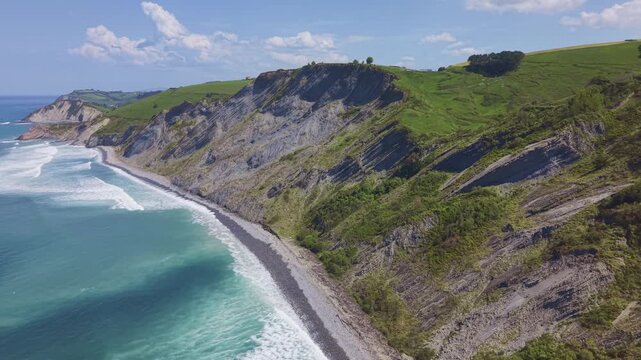 Rocky coastline and green cliffs aerial landscape. Flysch Begiratokia - Baratzazarrak. Deva, Gipuzkoa, Spain.