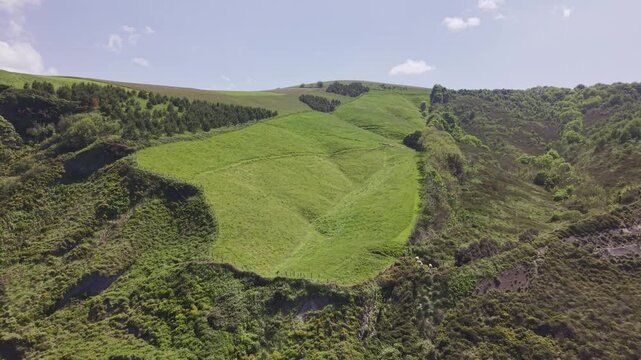 Aerial view of green hills and mountain landscape. Flysch Begiratokia - Baratzazarrak. Deva, Gipuzkoa, Spain.