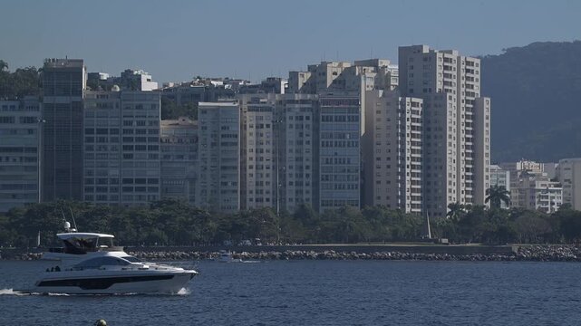 View of the Flamengo district skyline with high-rise buildings and lush trees along the waterfront of Guanabara Bay in Rio de Janeiro, State of Rio de Janeiro, Brazil.