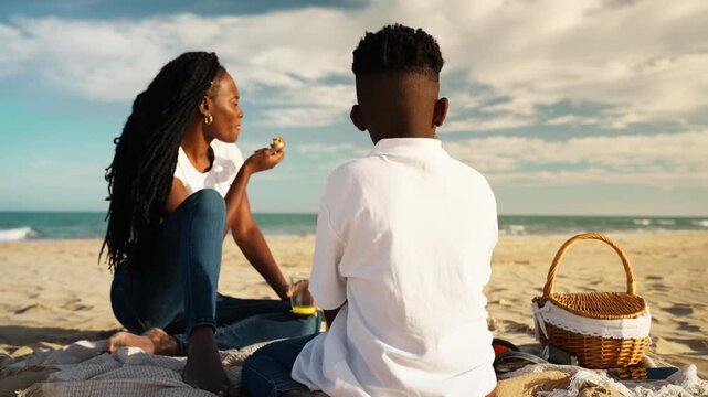 Joyful mother and son creating lasting memories together by sea. Happy childhood, family connection, love and carefree summer moments concept