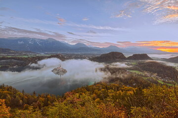 Colorful misty sunrise over the lake (Blejsko Jezero), the Assumption of Mary church and the castle, seen from Mala Osojnica hill. Bled-Slovenia-071