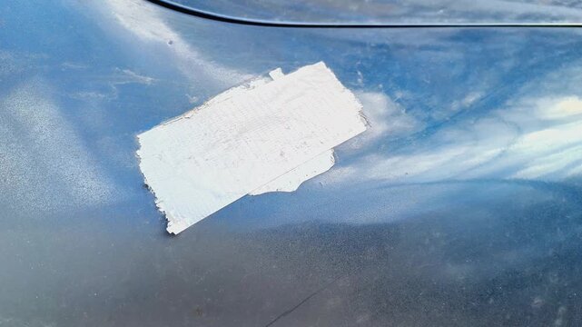 Car Hood With Silver Tape Repair Patch &mdash; Automotive Damage Background for Films