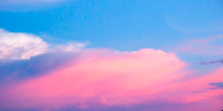 Vibrant Pink Clouds on Pastel Blue Sky at Sunset 