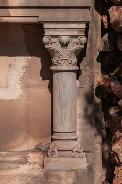Elements of architectural decorations of buildings, columns and tops, gypsum molding, wall texture and stucco patterns. On the streets in Barcelona, public places.