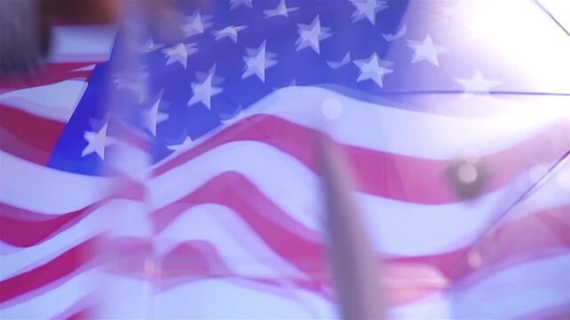 Hand putting a ballot paper into a transparent ballot box on the background of the USA flag