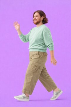 Joyful person walking confidently.
