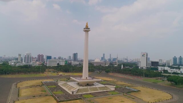 Wide aerial drone view of the Monas (National Monument) in the centre of the 80-hectare Merdeka Square in Central Jakarta, Indonesia.