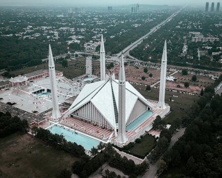 Drone Shot of Faisal Mosque Surrounded by Margalla Hills in Islamabad Pakistan