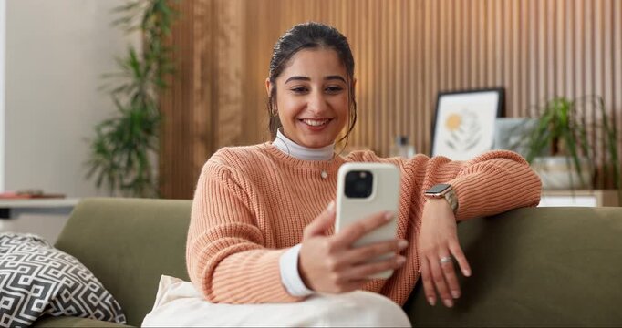 Phone, happy woman and wave on video call in home for online connection, contact and conversation. Relax, person and hello on mobile app on sofa for funny discussion, weekend update and virtual chat