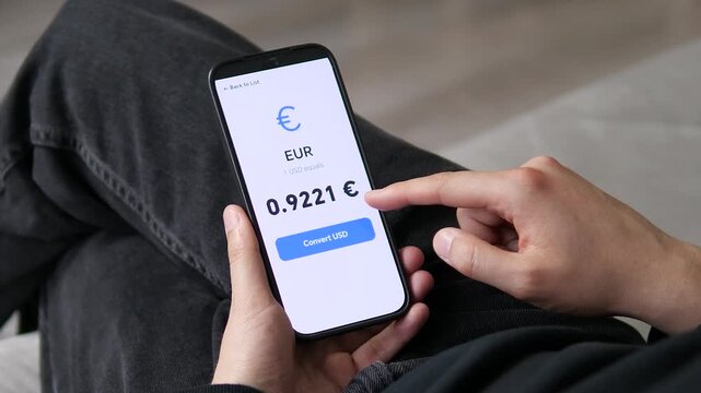 User checking the current value of the Euro against the Dollar. The large font and positive visual space make data consumption effortless. High demand for stress-free finance apps, modern software