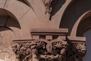 elements of architectural decorations of buildings, ancient arches and columns, pommel and patterns, on the streets in Barcelona, public places. © Kozlik_mozlik