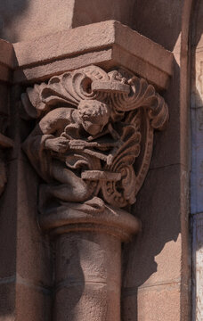 elements of architectural decorations of buildings, ancient arches and columns, pommel and patterns, on the streets in Barcelona, public places.
