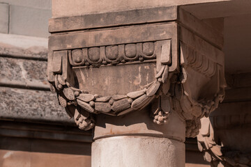 elements of architectural decorations of buildings, ancient arches and columns, pommel and patterns, on the streets in Barcelona, public places. © Kozlik_mozlik