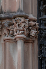 elements of architectural decorations of buildings, ancient arches and columns, pommel and patterns, on the streets in Barcelona, public places. © Kozlik_mozlik