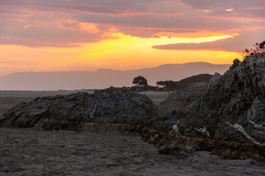 low tide , rocky coastline of Grotto Beach, Hermanus, South Africa at dusk