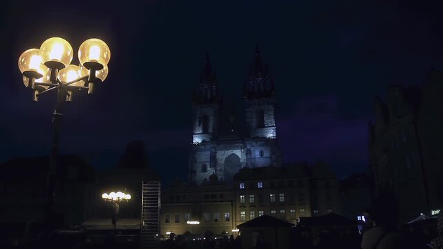 Glowing Street Lantern with Tyn Church in Prague Center at Twilight - 4K