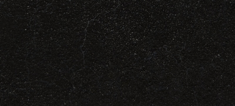Black granite texture with subtle white speckles, polished dark stone surface background, elegant charcoal marble slab for kitchen countertop design