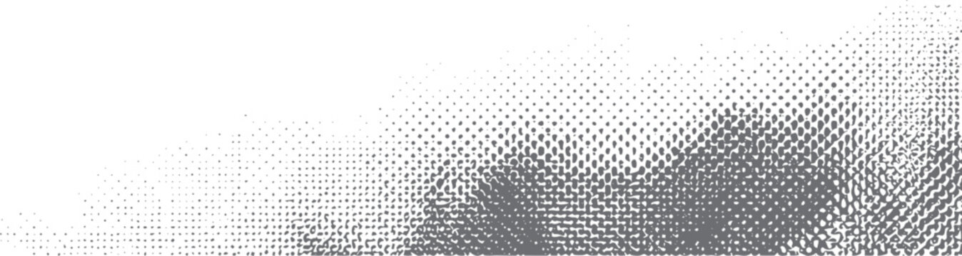 Grey halftone dots pattern fading from dense to sparse on white background