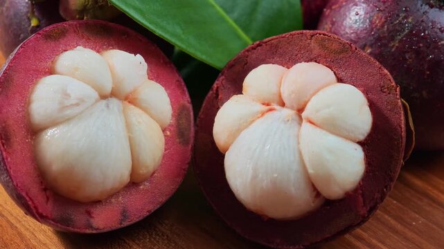 Fresh mangosteen on a wooden floor.