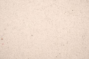 Fototapeta premium Close up texture of light beige suede leather surface with visible fiber details