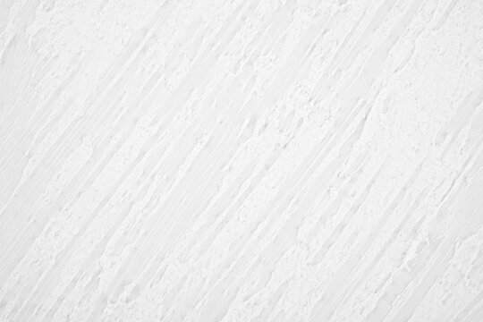 Textured white wall with diagonal brush strokes