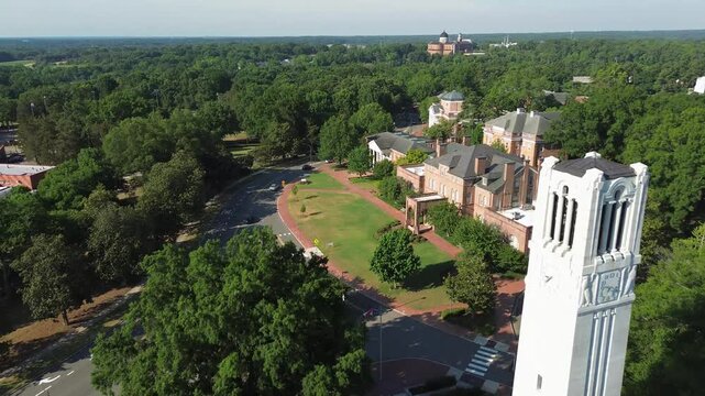 Aerial flyover view of the NC State University bell tower and campus in Raleigh , North Carolina