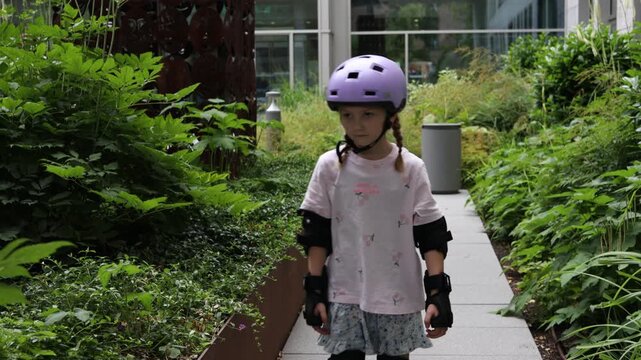 daughter enjoying outdoor rollerblading in a modern urban garden setting