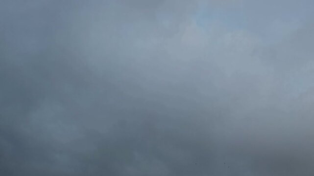 Blue stratocumulus clouds transform in orange