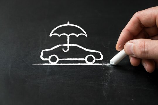 Hand Drawing Car Under Umbrella on Chalkboard Auto Insurance Protection Concept
