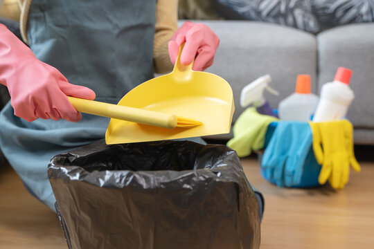 Woman cleaning dust on the floor.
