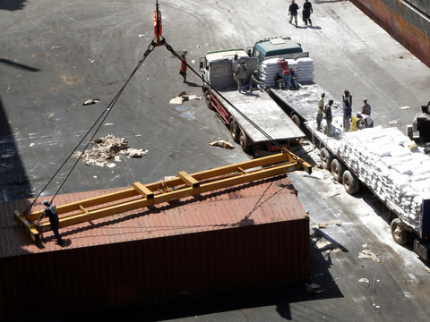  discharging flour from a ship in banjul harbour in gambia