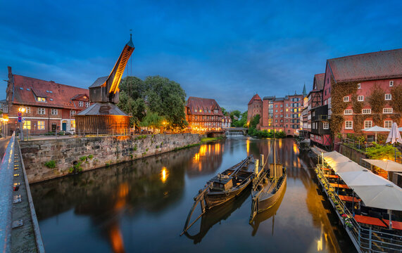 Luneburg, Germany - Panoramic view of old hanseatic harbor with Ilmenau river, boats and historic crane