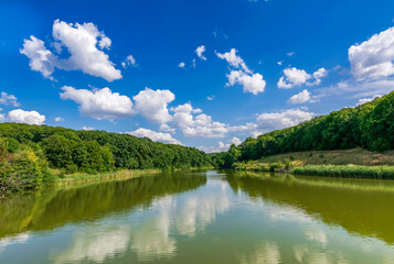 Fototapeta premium Beautiful summer landscape with reflection in water and sky