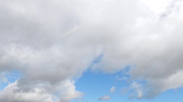 White stratocumulus clouds moving in the sky at dawn
