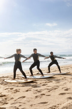 Surf lesson on sandy beach