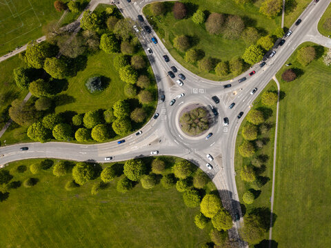 Aerial view directly above a busy traffic roundabout in countryside