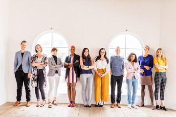 Fototapeta premium Diverse group of men and women standing together indoors