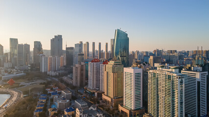 Obraz premium Modern Urban Skyline With Dense High-rise Buildings At Dawn