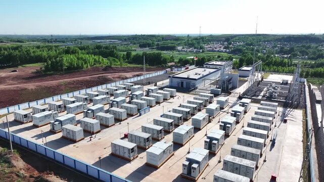 Aerial view of large-scale energy storage power station with battery container arrays