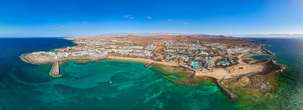 Aerial sunrise view of  Exclusive Waterfront Hotel Grounds and Swimming Pools at Golden Hour in the Canary Islands