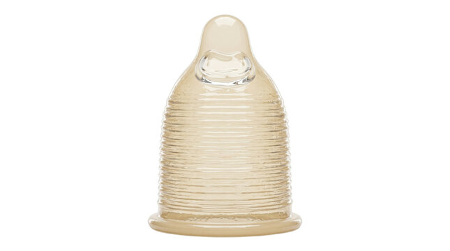 Ribbed transparent latex condom rolled up for sexual protection
