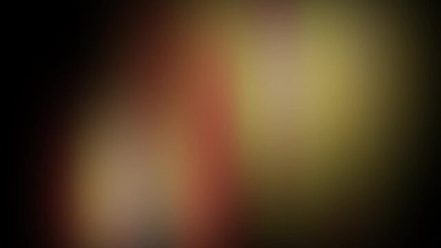 Cinematic Light Leak Animation with Soft Moving Red, Orange, Yellow, And Golden Glow Gradients On A Dark Background.  Film Overlays, Video Transitions, Motion Graphics Effects, 