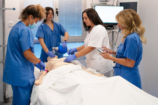 Medical team practicing resuscitation during healthcare simulation training