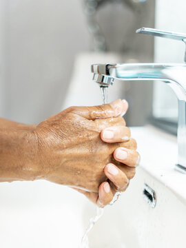 	
Lifestyle Health care. Close-up hands person using alcohol gel, spraying to kill germs and clean their. washing hands water with soap, sanitizer to eliminate germs. Body care, cleaning bacteria.