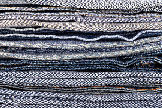 Stacked denim jeans fabric texture background