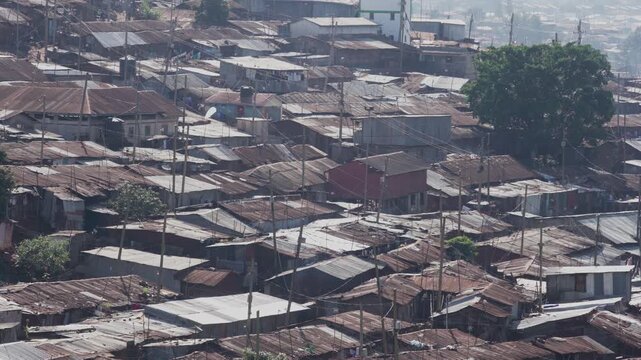 Nairobi, Kenya - 30 April 2024: View of the dense informal settlement with corrugated iron rooftops and power lines in Nairobi, Nairobi County, Kenya.