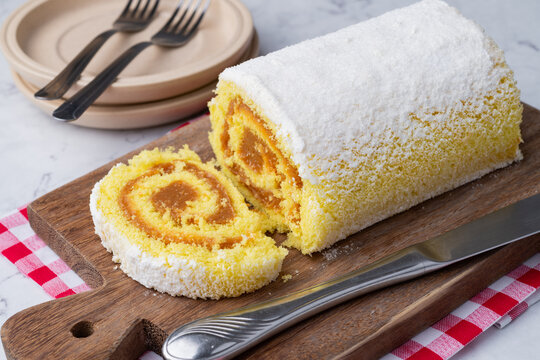 Roll cake or swiss cake filled with dulce de leche
