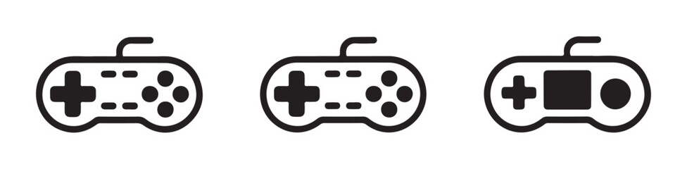 Three different styles of vintage retro video game controllers illustrated as black vector design icons. © MSTGIRATUN